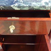 Flamed mahogany enfilade with sea green marble in Empire style.