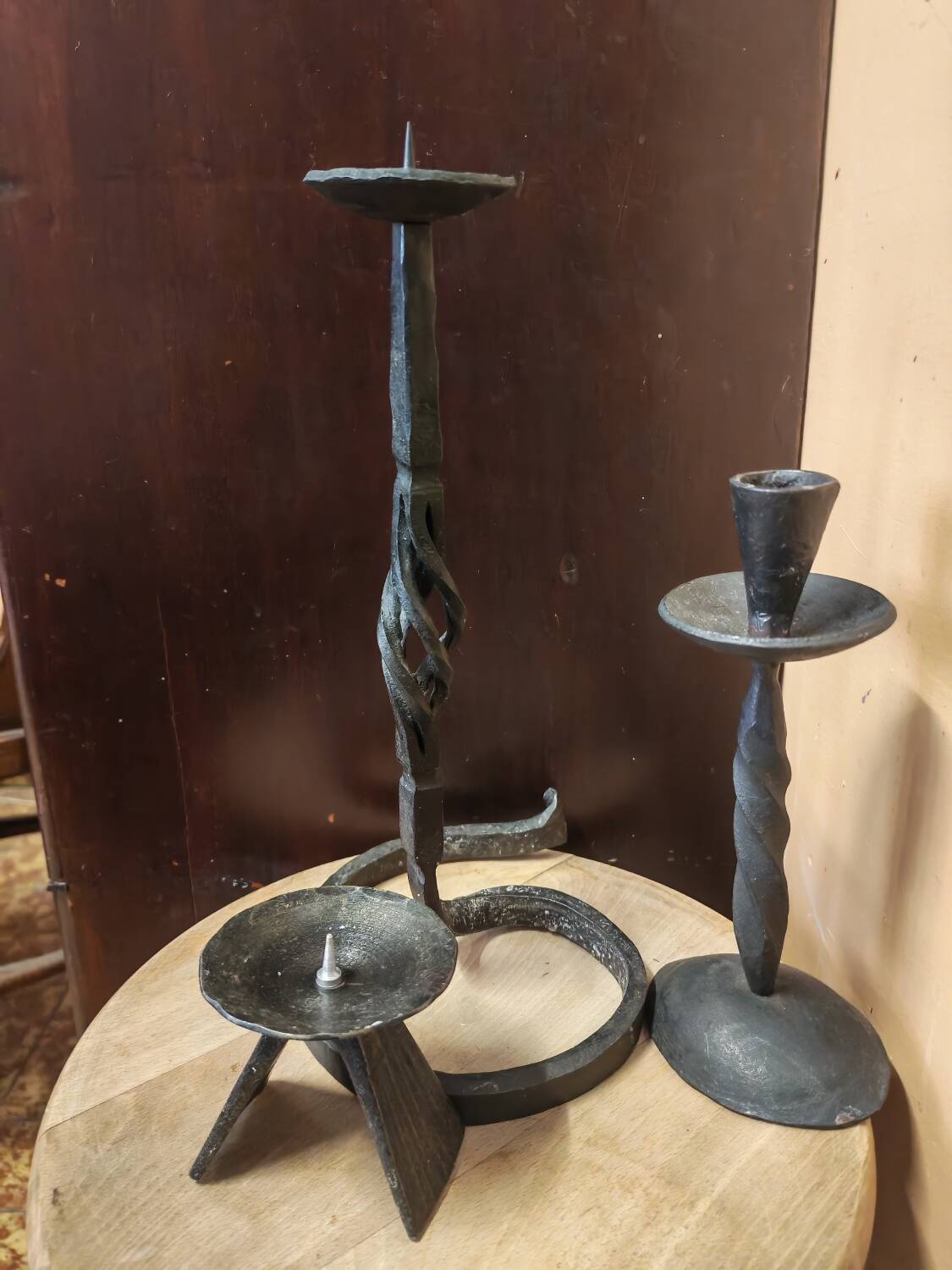 Set of 3 candlesticks and a candle holder in wrought iron.