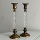 Pair of twisted metal and glass candlesticks