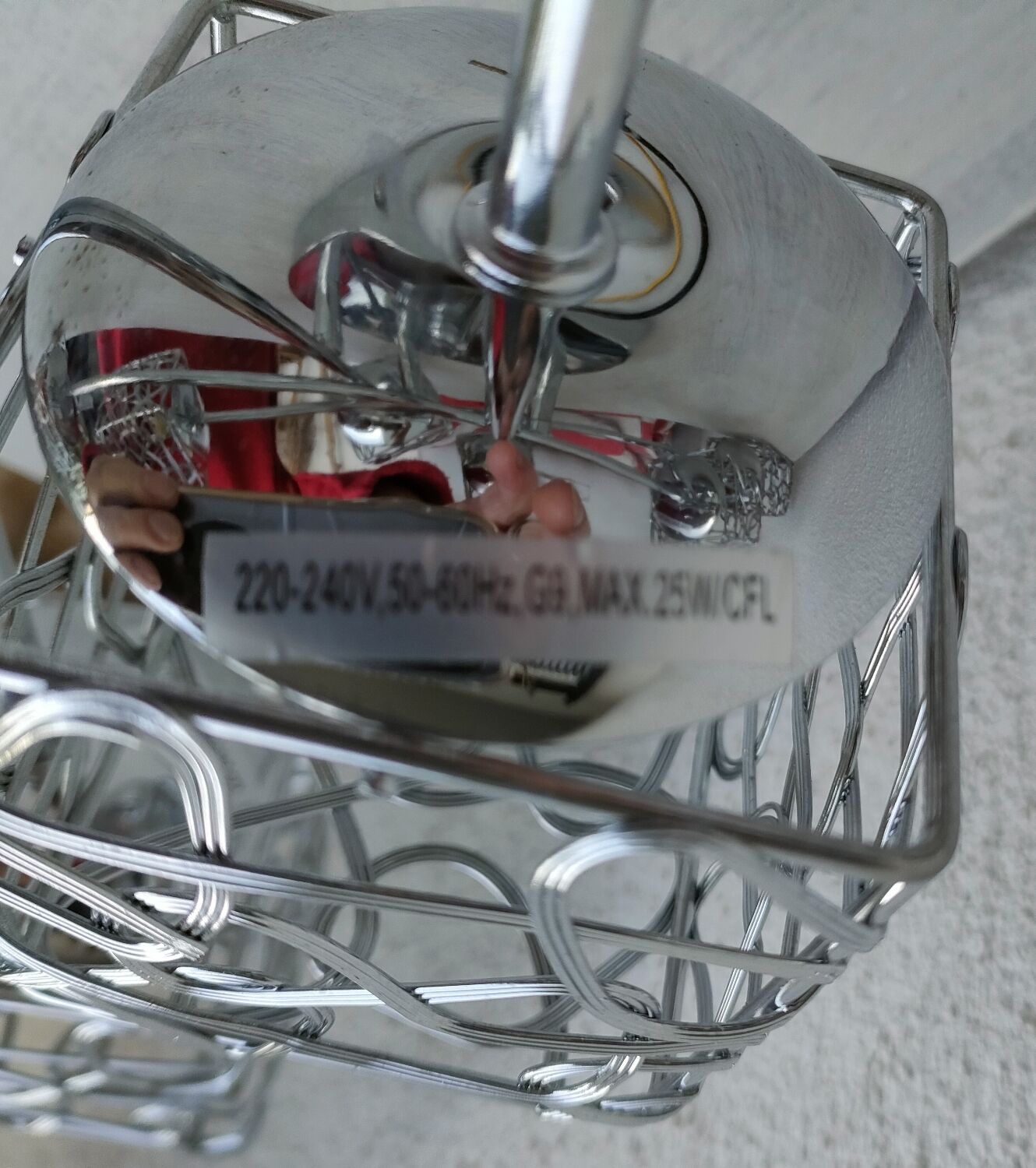 Articulated chromed metal luminaire