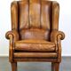 Sheepskin wingback chair with a unique design and a beautiful patina