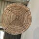 Braided rattan suspension in the shape of a natural accordion