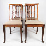 Set of four dining room chairs in rosewood and upholstered with light fabric, 1920s