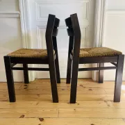 Pair of straw-seated wooden chairs in the regain style.