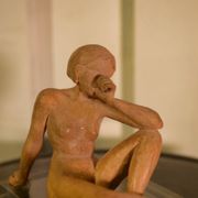 Terracotta sculpture of a seated woman by Norbert Treca contemporary art.