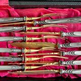 Set of knives and forks for fruits.