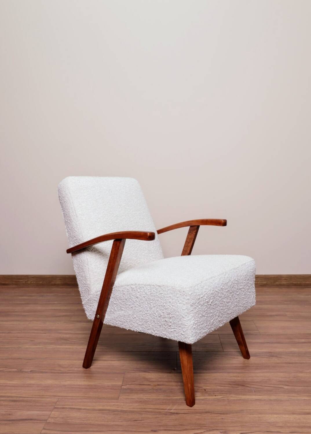 Vintage armchair in pearl bouclé, mid-century modern design from the 1960s.
