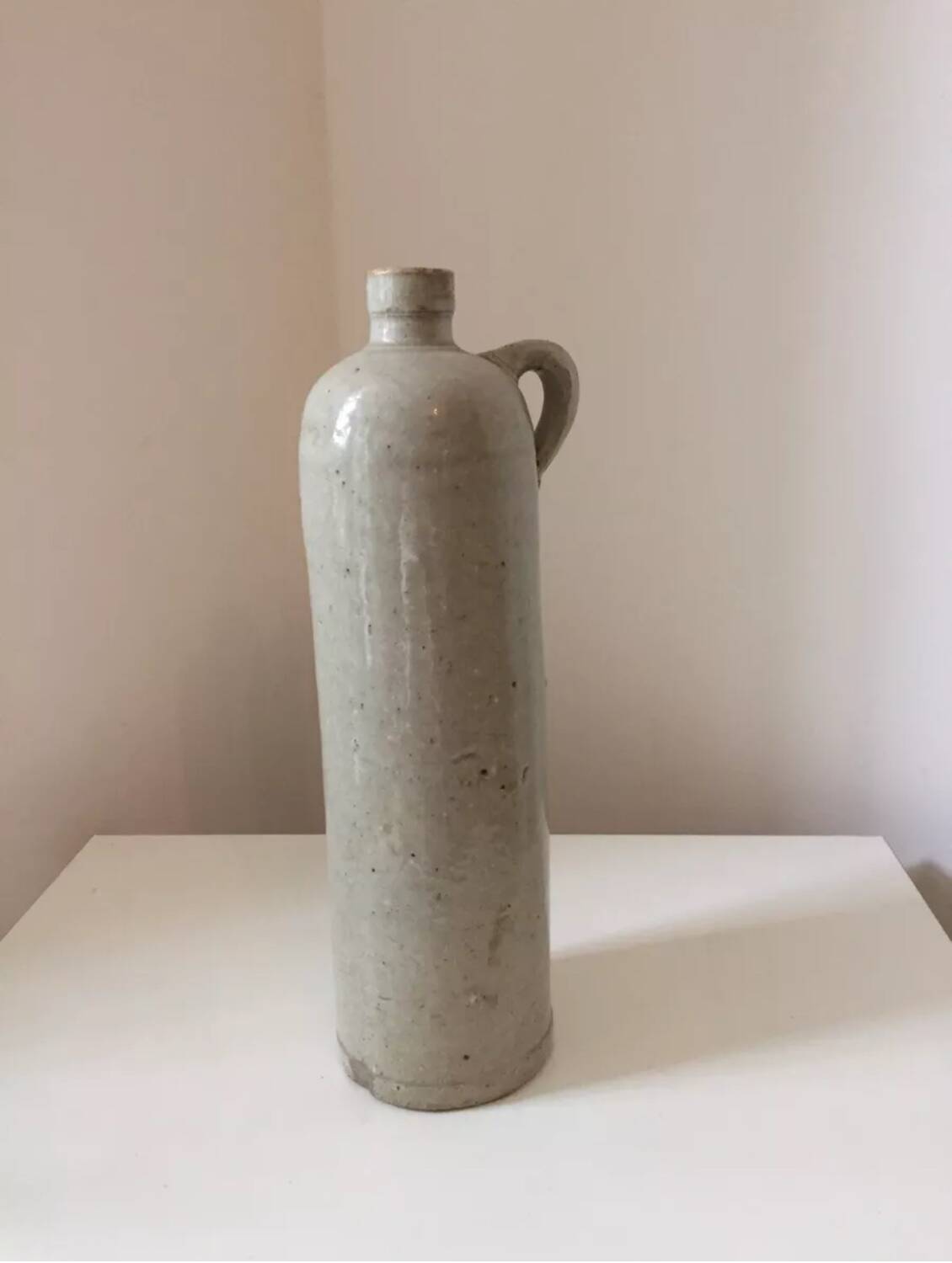Antique grey stoneware bottle with vintage handle