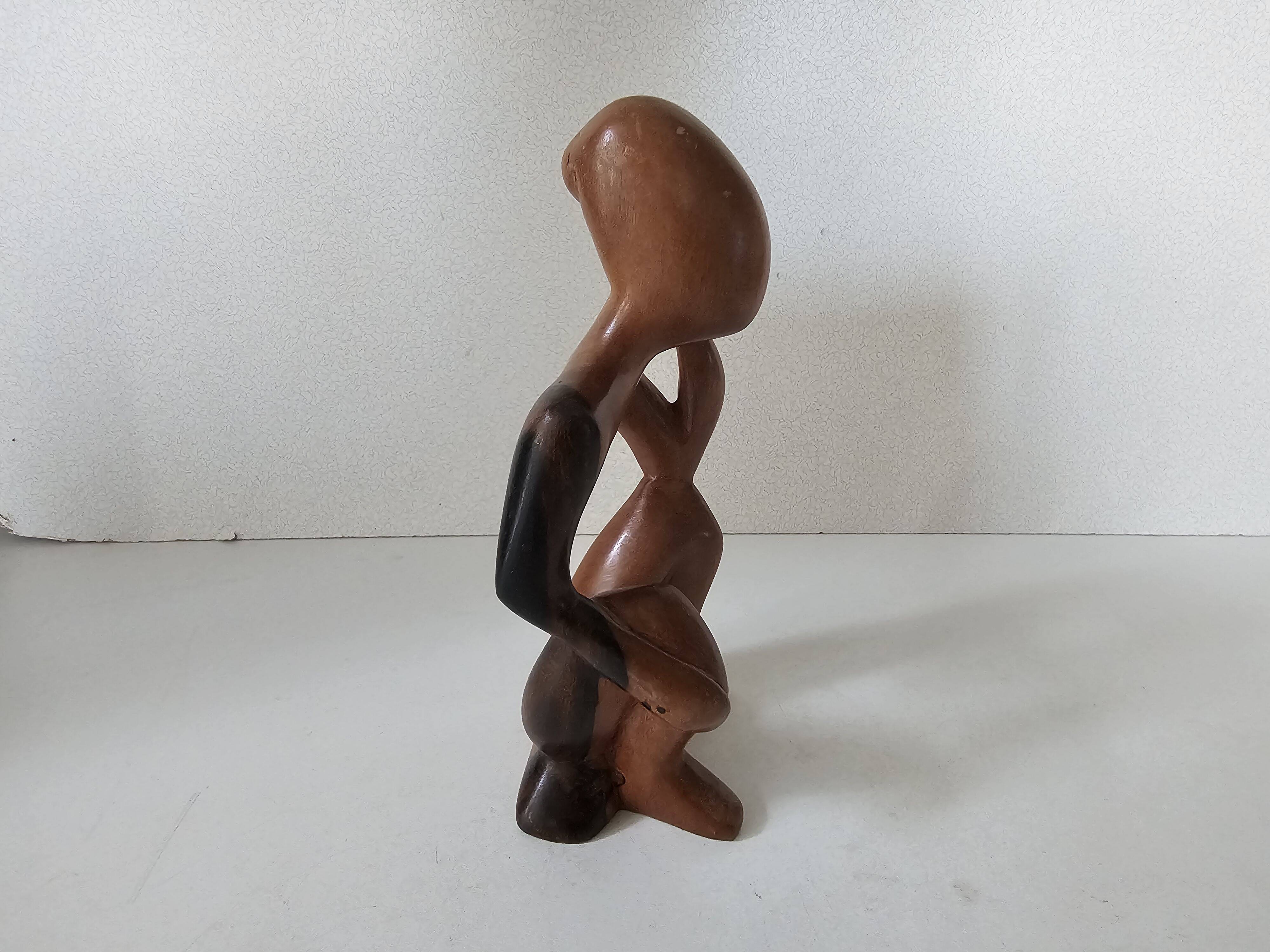 Wooden statuette sculpture of a thinking man design