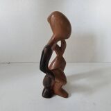 Wooden statuette sculpture of a thinking man design