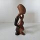 Wooden statuette sculpture of a thinking man design