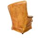 Fauteuil club en cuir de mouton des années 1970 avec porte-revues