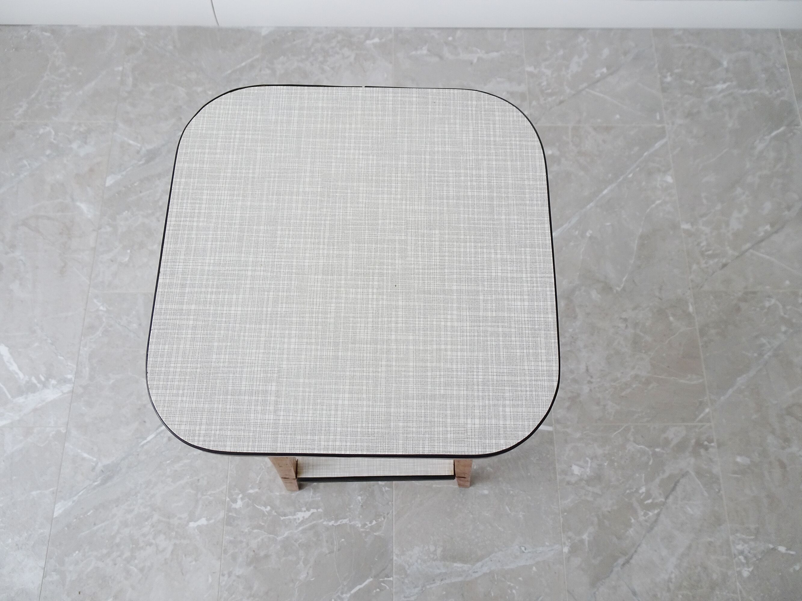Plant stand made of wood and formica with two shelves, flower column