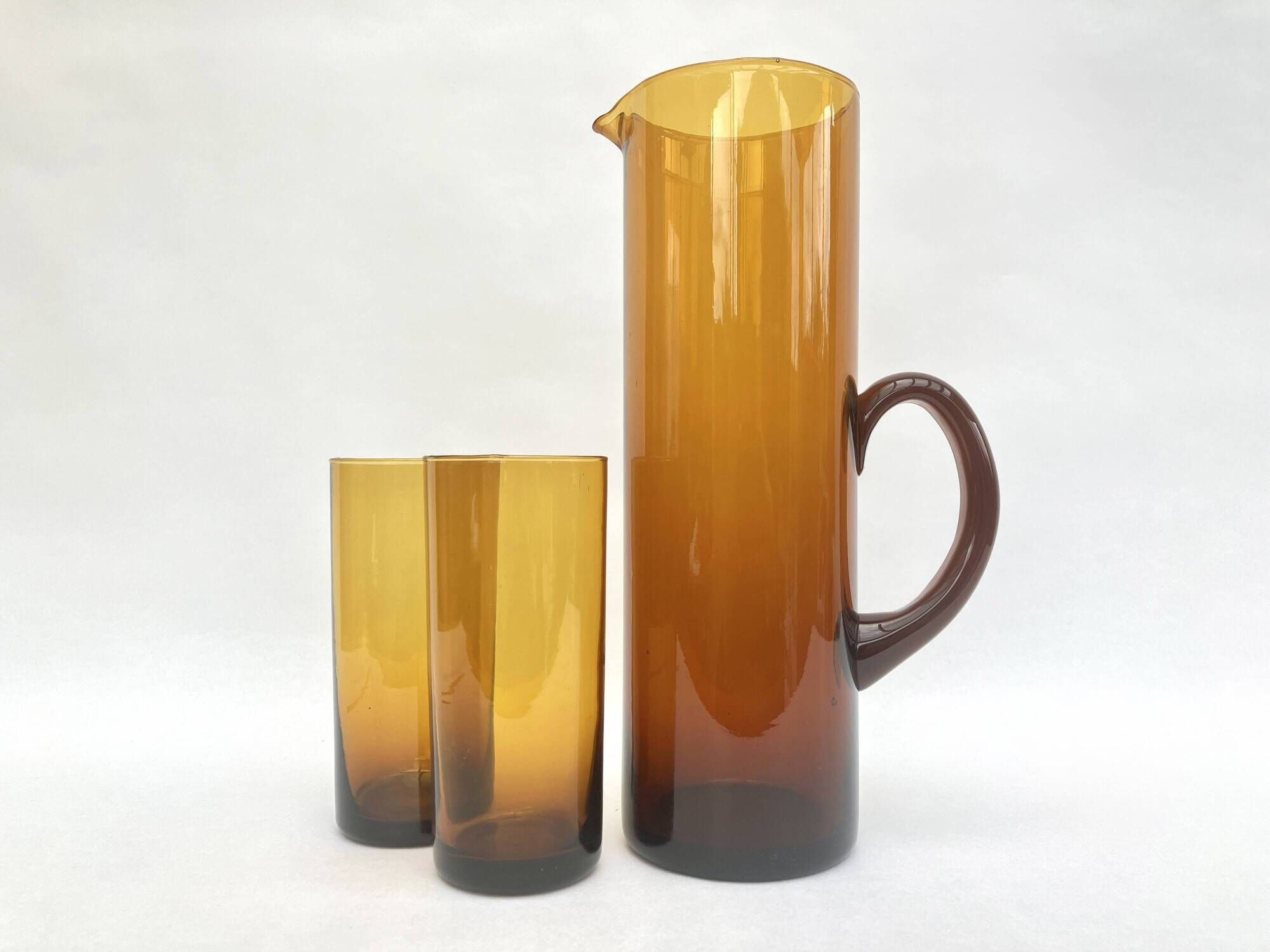 Carafe/pitcher and two amber glasses • Blown glass • France • 1970s