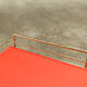 Red and brass vintage roulette service with vinyl record rack