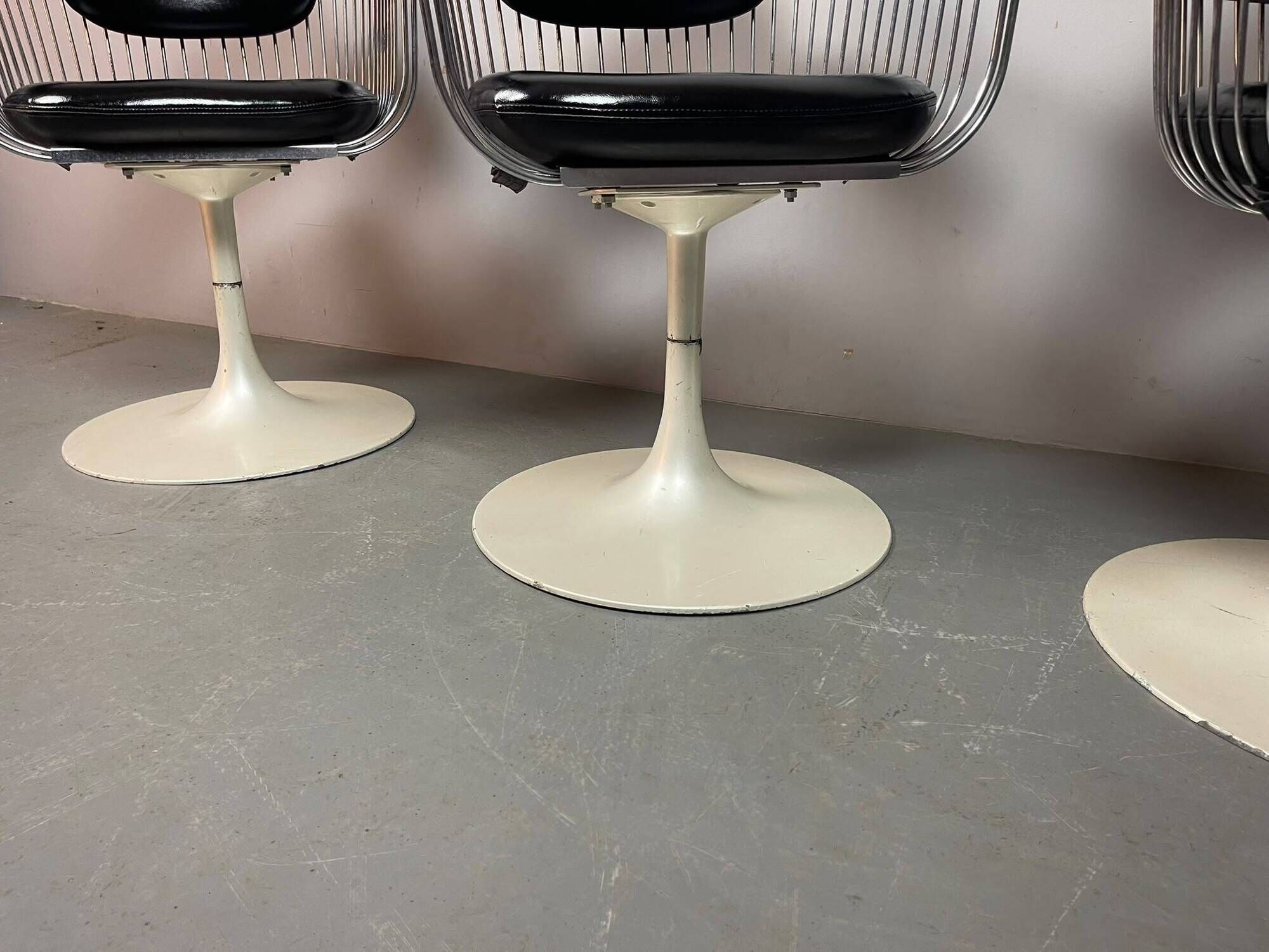 A striking set of four vintage swivel dining chairs