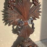 Antique wooden crucifix carved from the Black Forest with grapes and leaves.