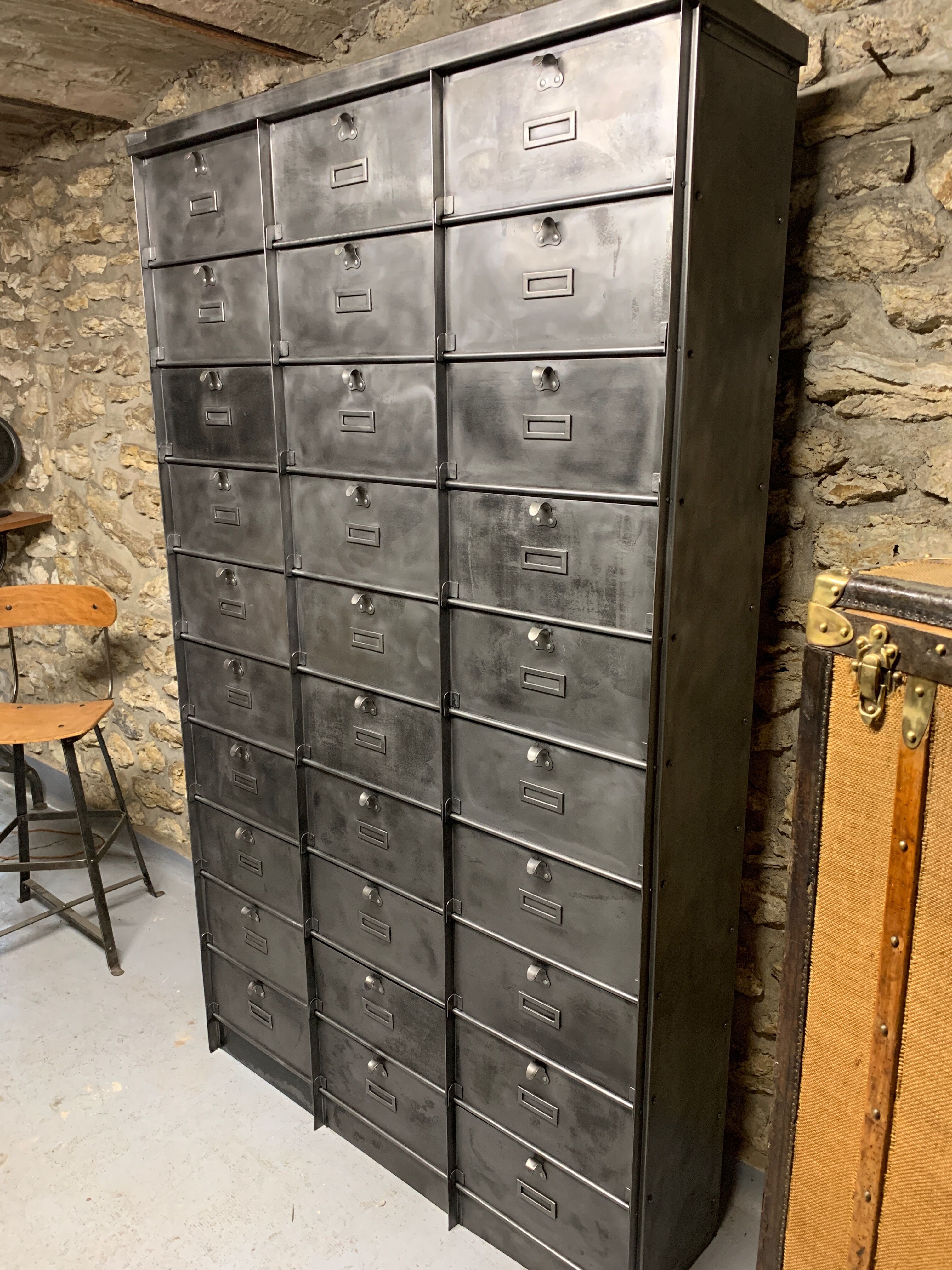 Industrial cladding furniture in brushed and patinated steel