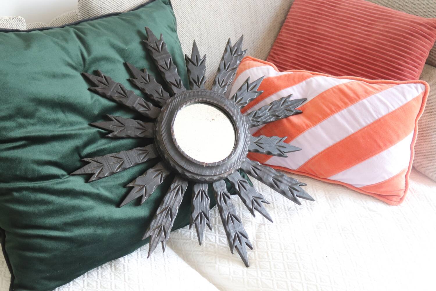 Antique black wooden sun mirror