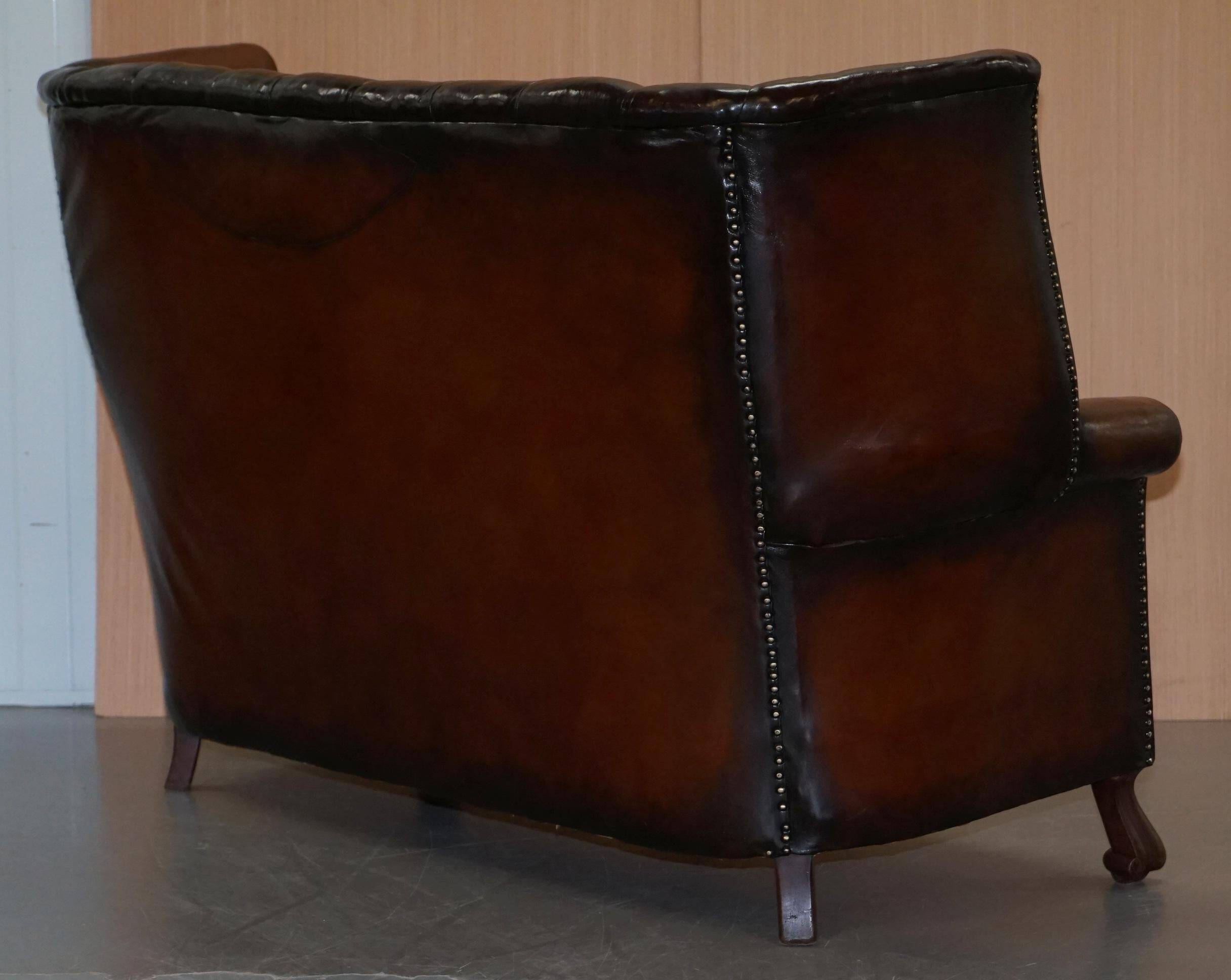 Victorian leather canapé and armchair, barrel back, circa 1860, restored.