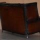 Victorian leather canapé and armchair, barrel back, circa 1860, restored.