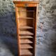French antique wardrobe with curtain in oak, circa 1920–1930.
