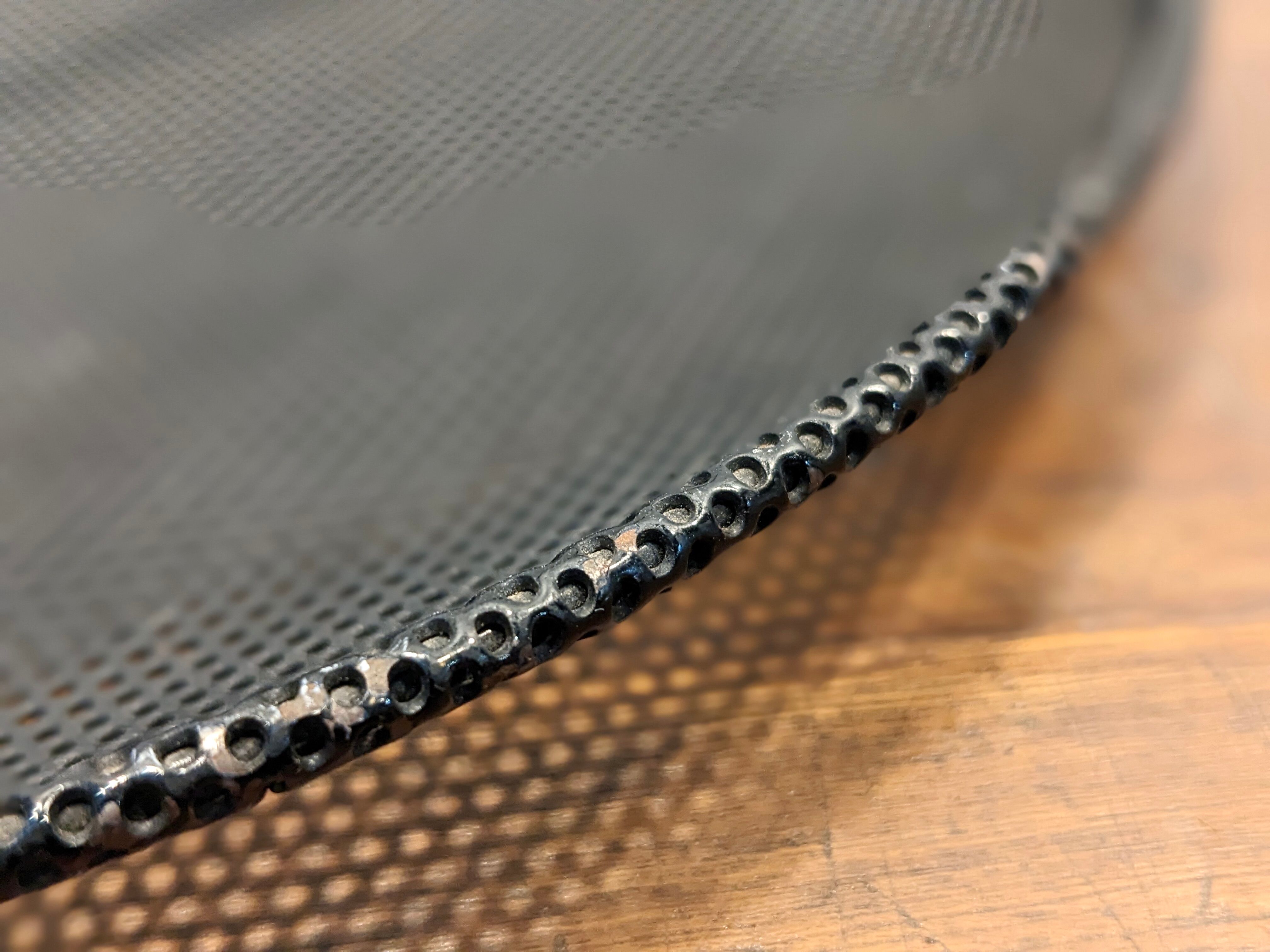 Black metal basket by Mathieu Mategot