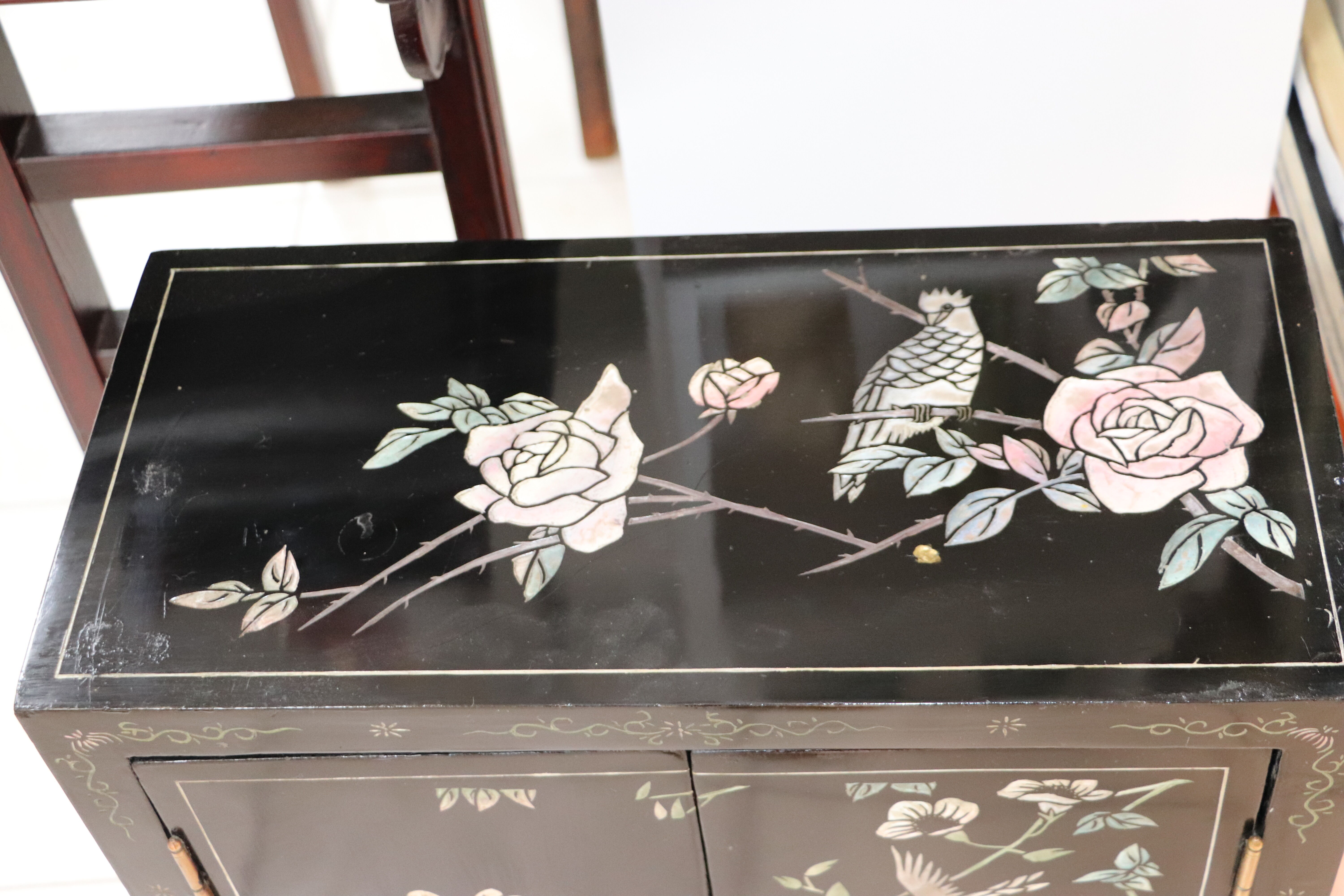 Small storage or bedside table lacquered black, incised and painted