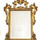 Large Italian mirror in carved wood, traditional gilding, 1980s.