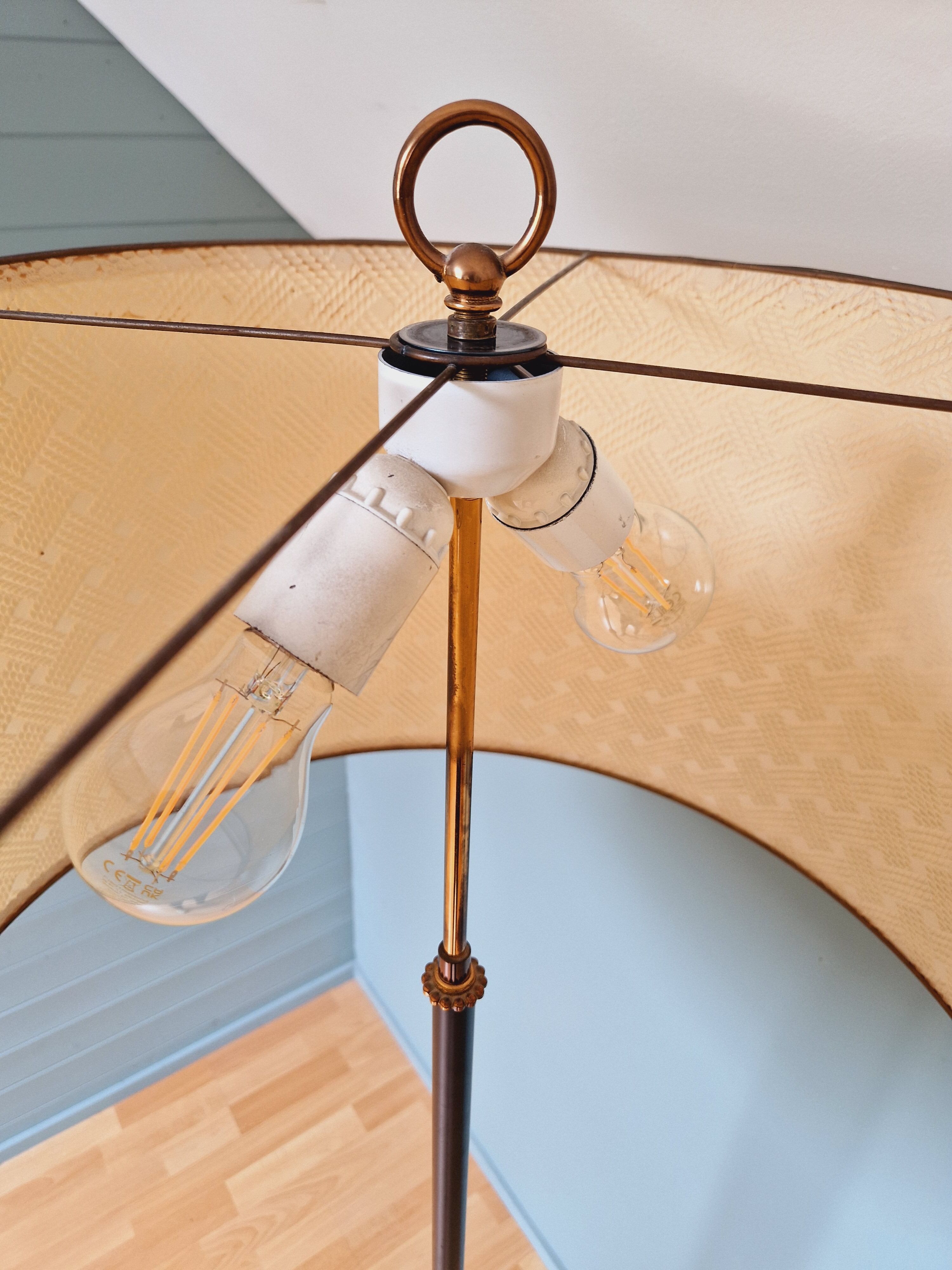 Vintage tripod floor lamp in black lacquered metal and brass, 50s