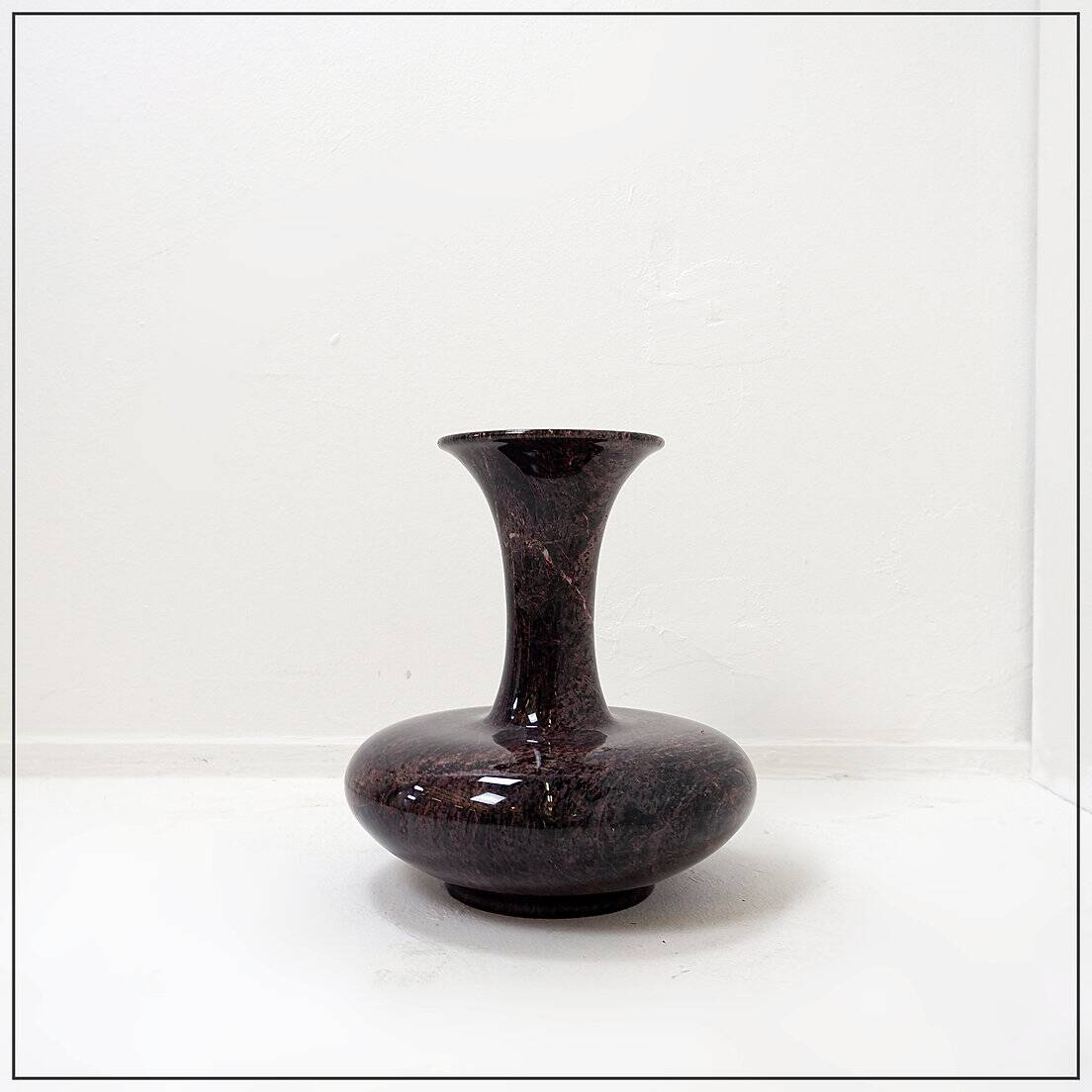 Polished granite vase