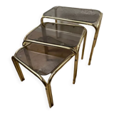 Series of 3 nesting tables in smoked glass & gilded brass