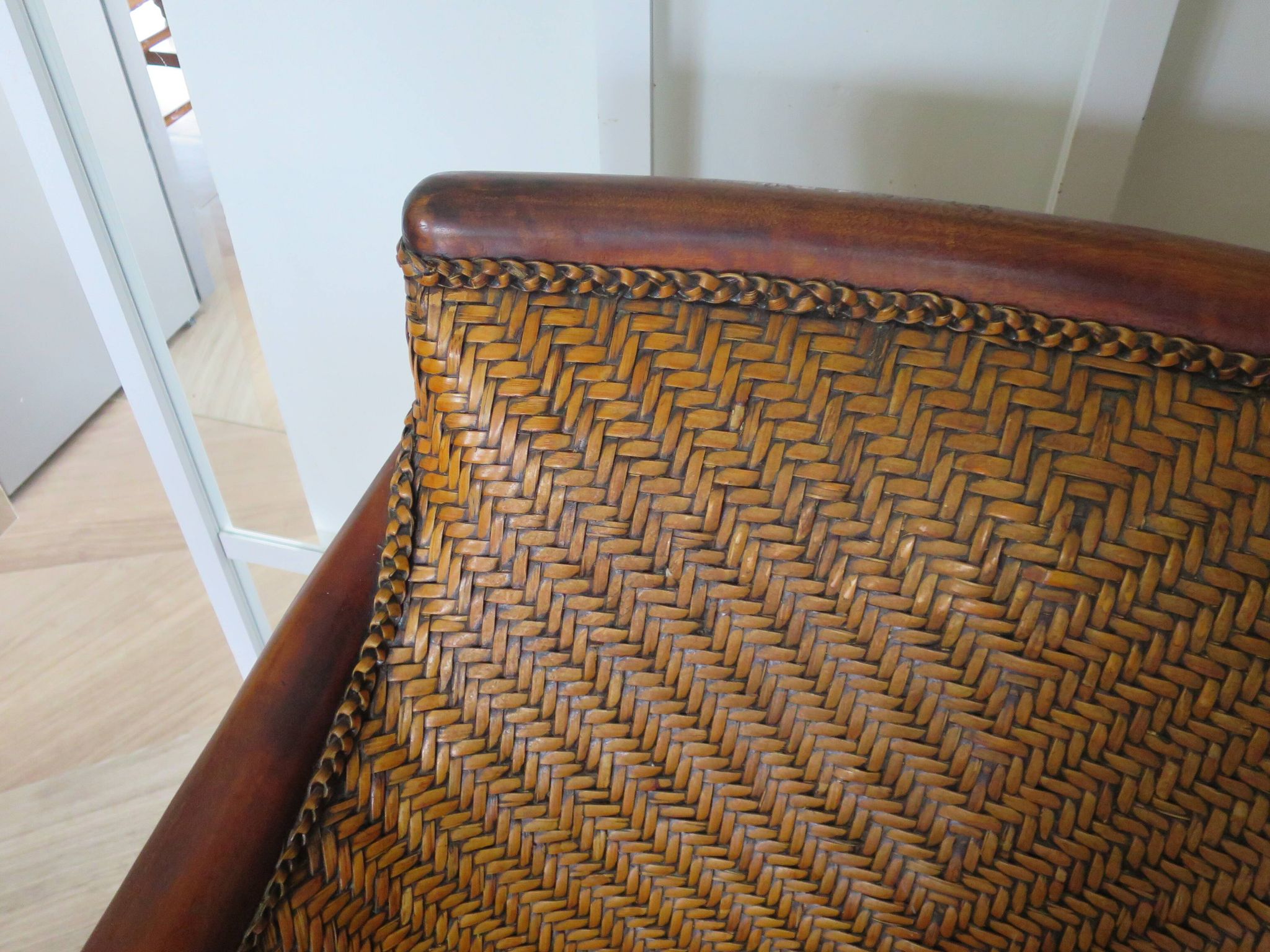 Woven rattan armchair and exotic wood in colonial style, 1980s.