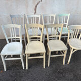 Set of 8 mismatched white bistro chairs
