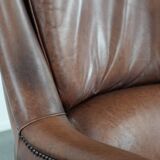 Cognac brown cow leather armchair with decorative nail finish