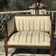 Low armchair in finely carved wood in the Louis XVI style from the 19th century