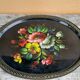 Black lacquered metal tray with multicoloured vintage Russian floral decoration.