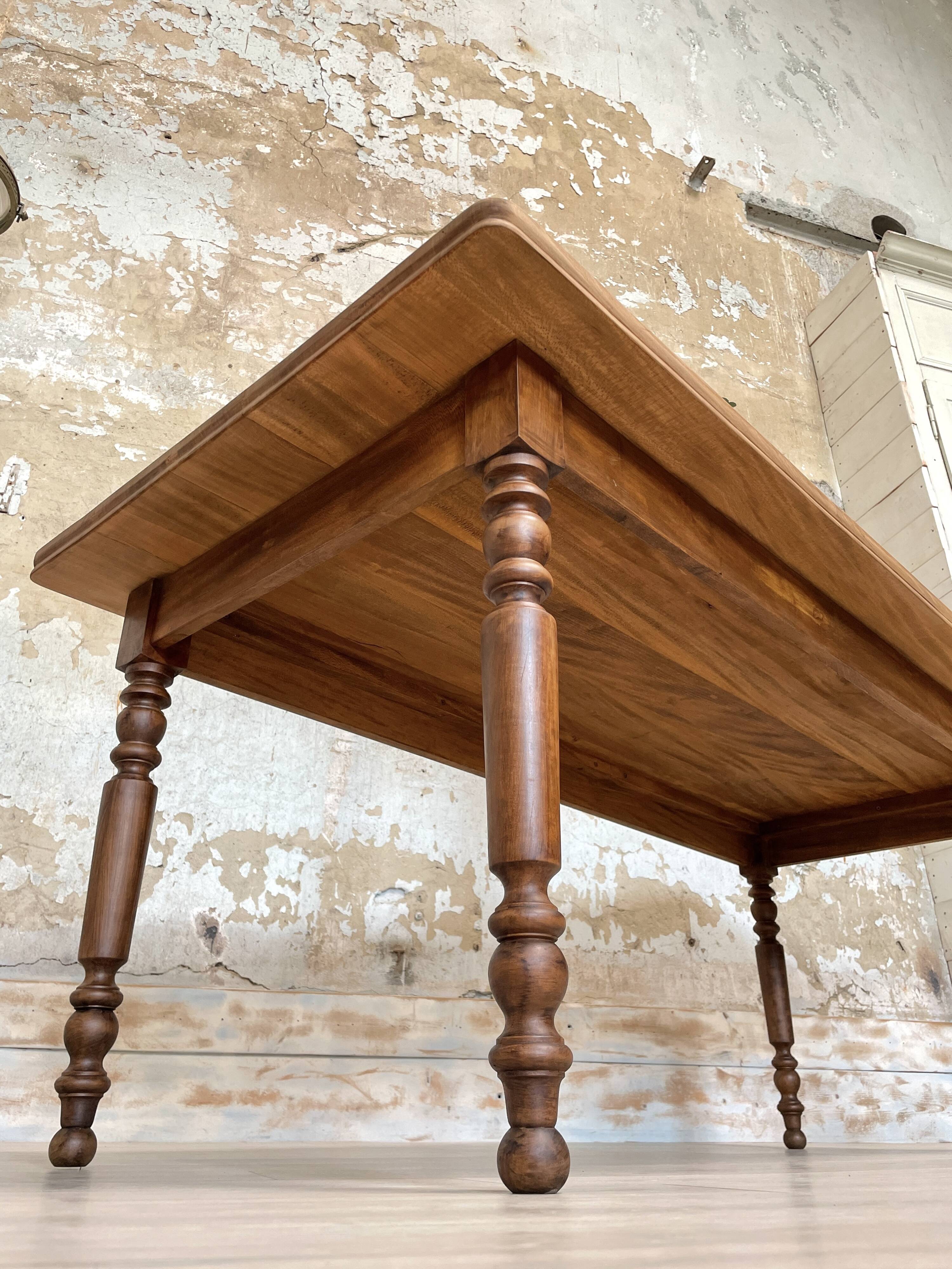 Vintage farmhouse table with turned legs.
