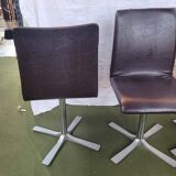 Set of 4 metal and imitation leather swivel chairs.
