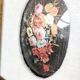 Vintage floral print with oval mat and gold wooden frame.
