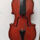 violin and decorative archer in antique varnished wood