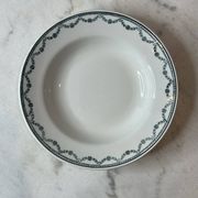 Set of 12 deep plates Saint Amand with floral garland decoration.
