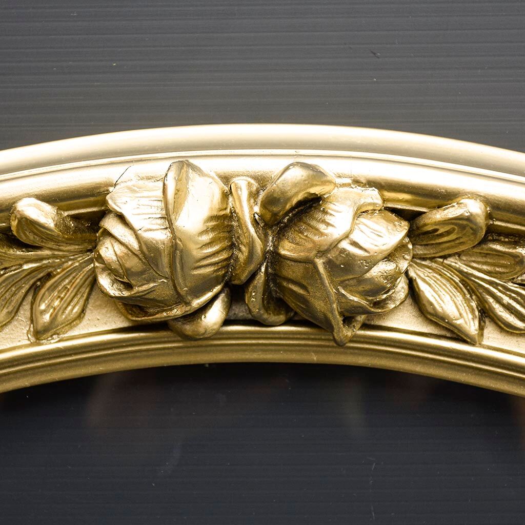 Delightful empty old gilded oval frame with carved wood and stucco flowers 63 x 53