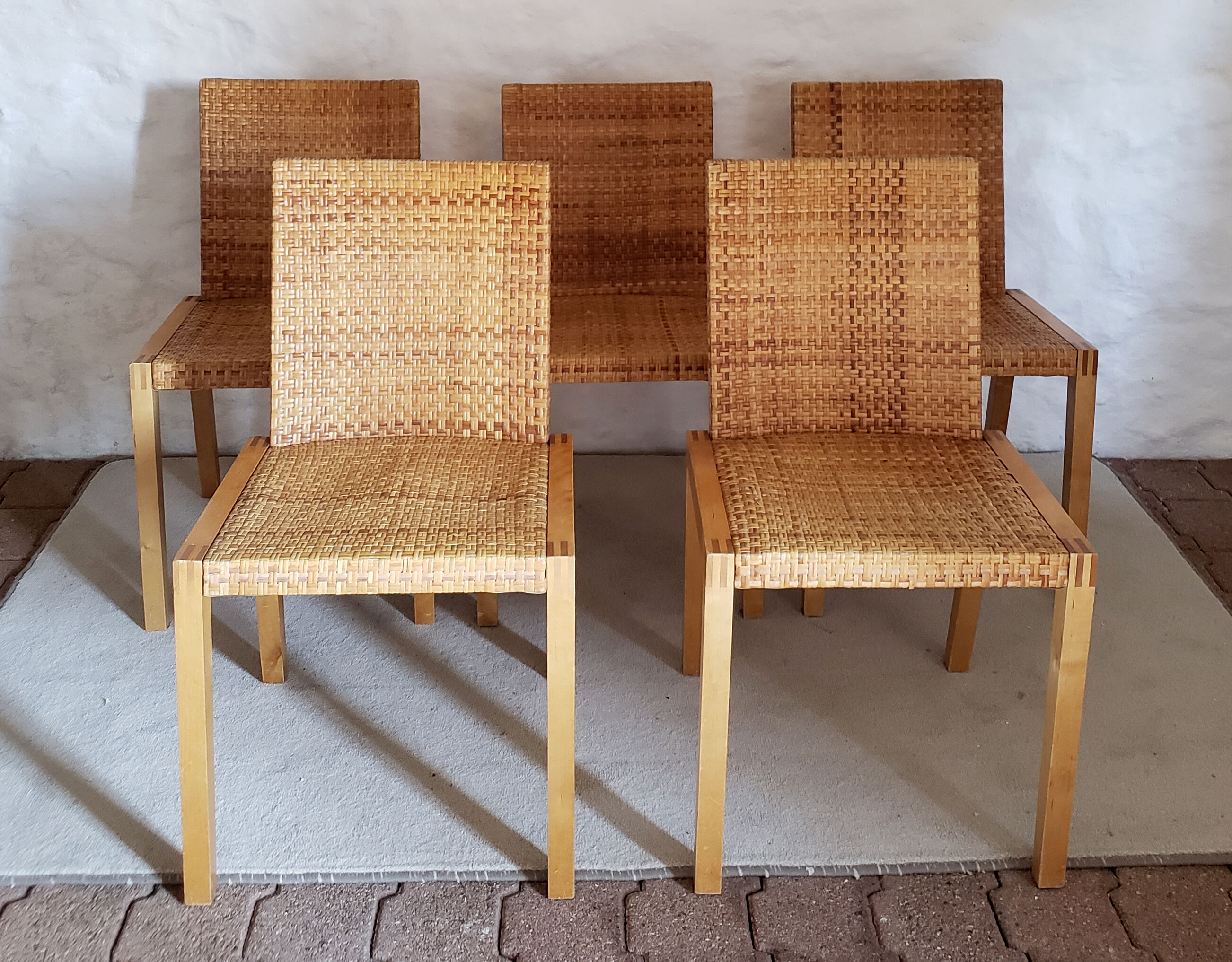 5 wooden and rattan chairs