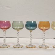 Set of 6 colored crystal stemmed glasses with gold twisted foot.