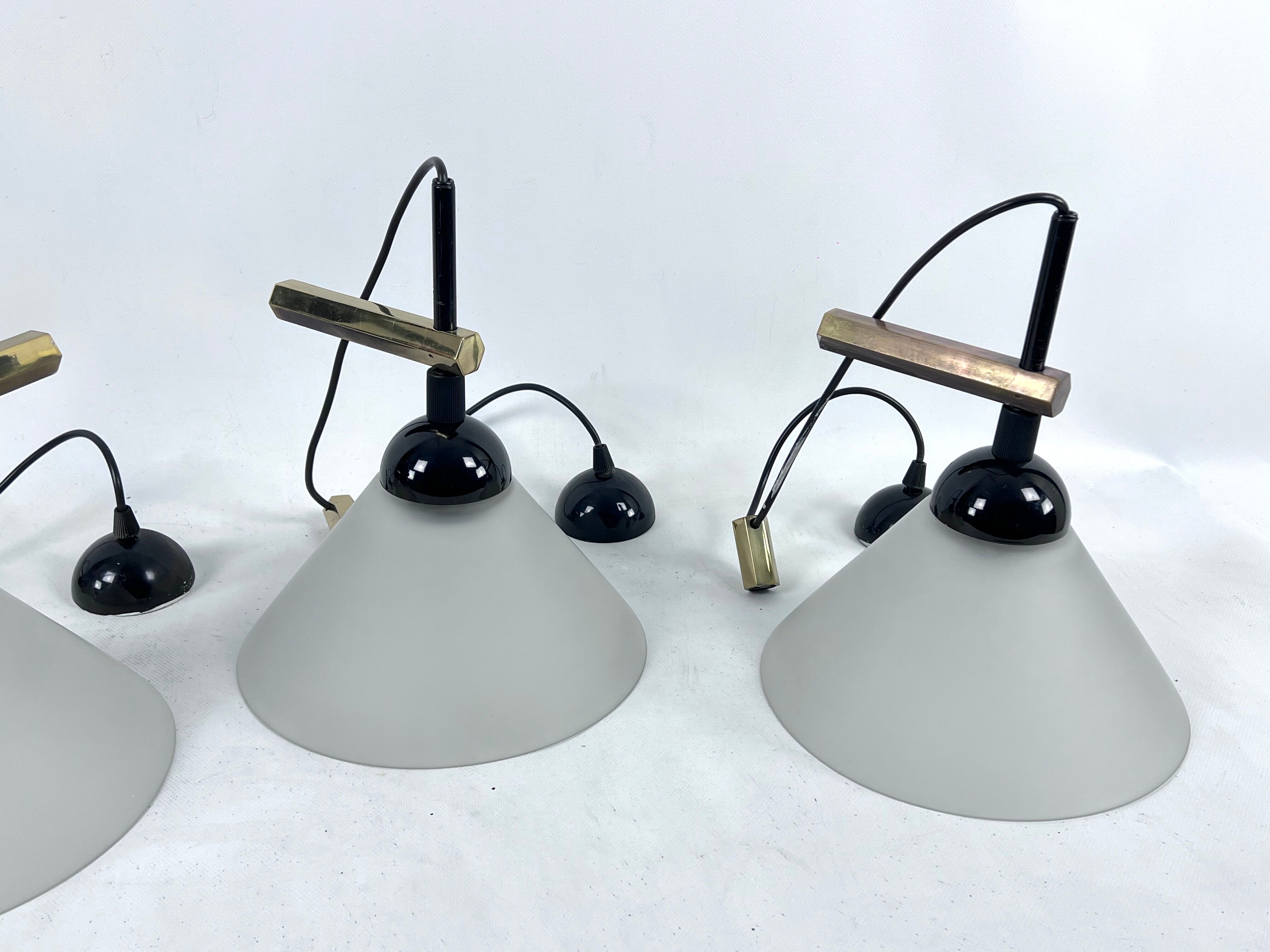 Rare Set of four Italian Modern brass and Murano glass wall lamps by Quattrifolio. 1970s