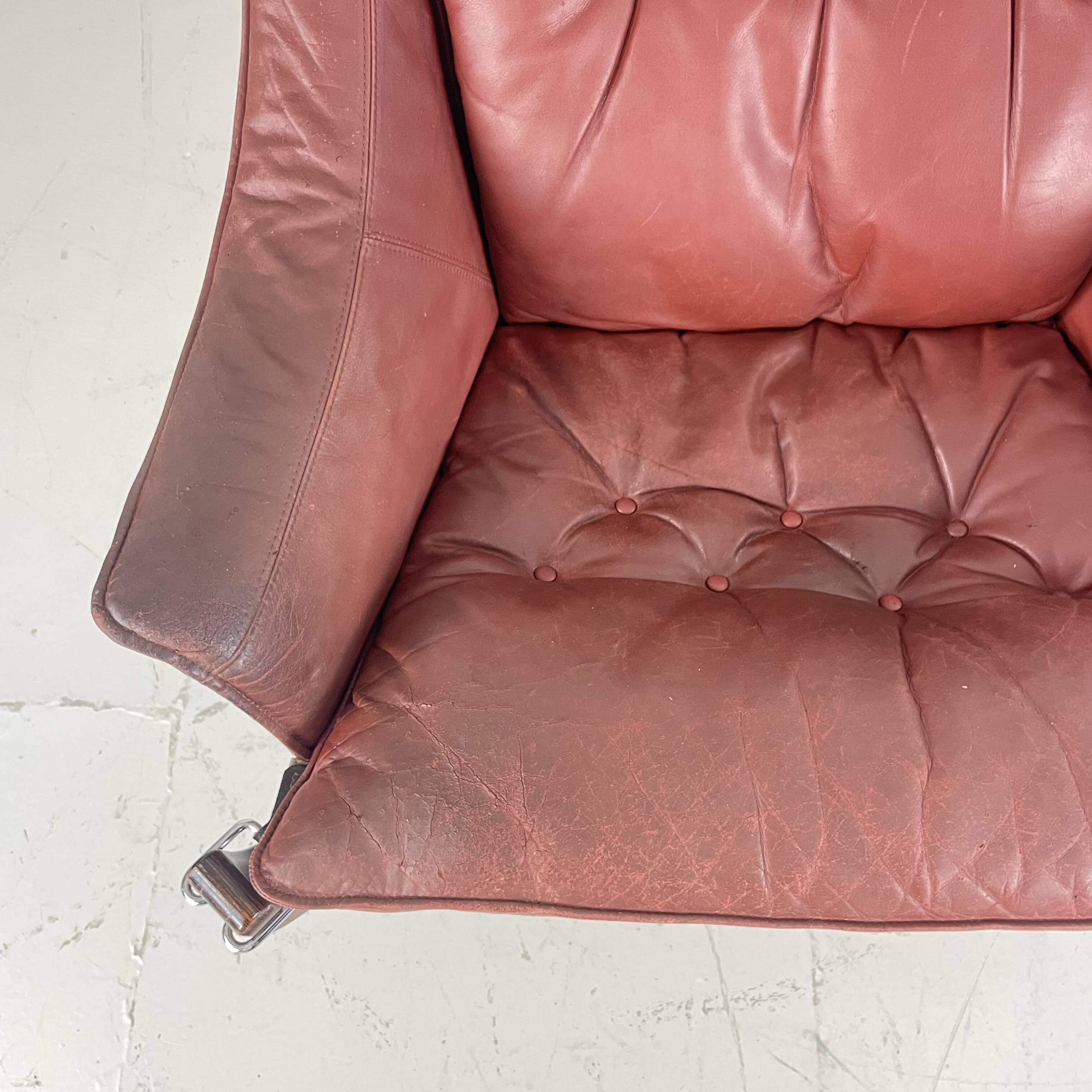 Vintage winged leather high backed Falcon chair designed by Sigurd Resell