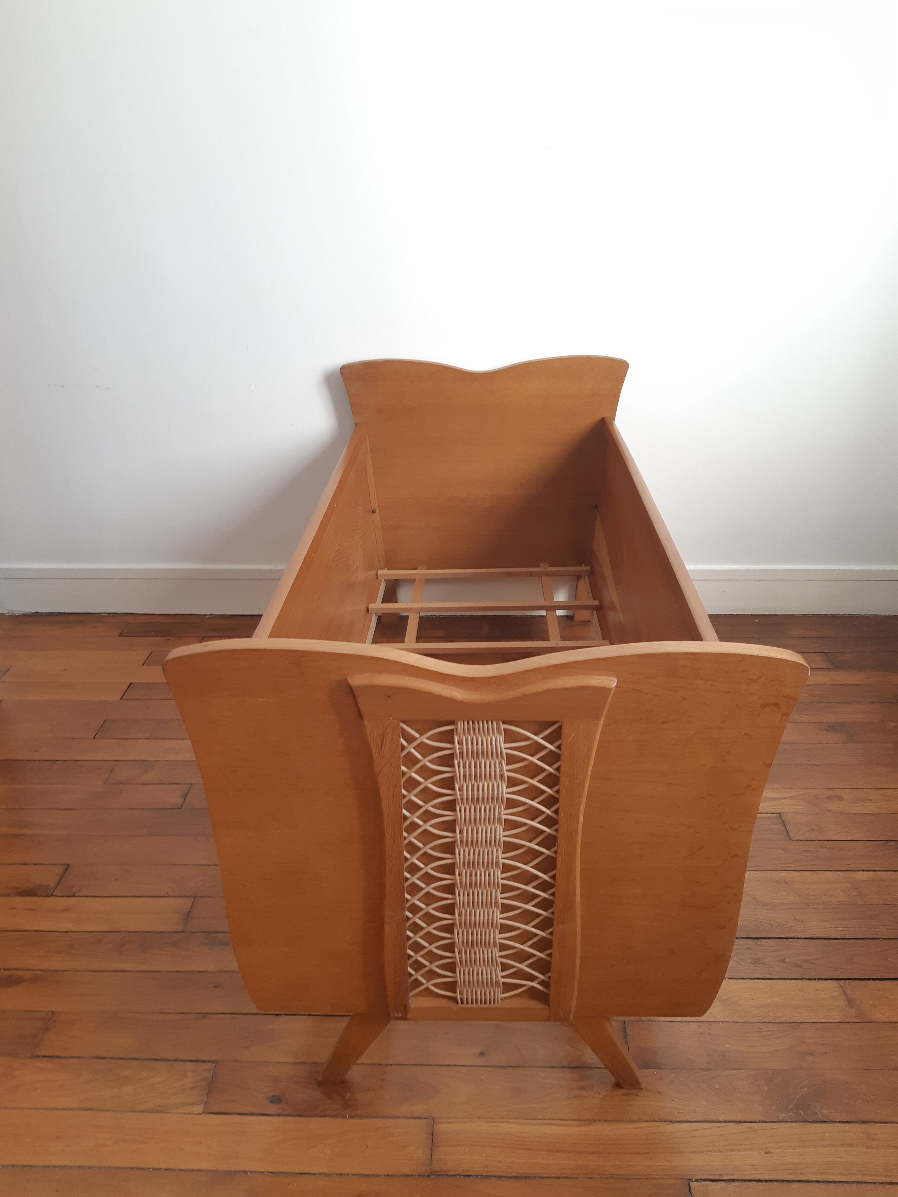 Wooden bed and vintage rattan