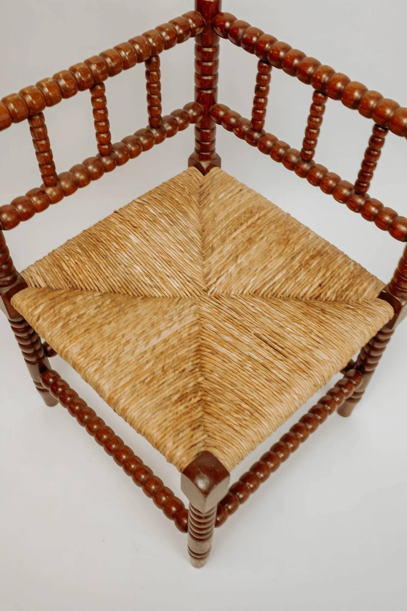 Classic vintage bobbin corner armchair