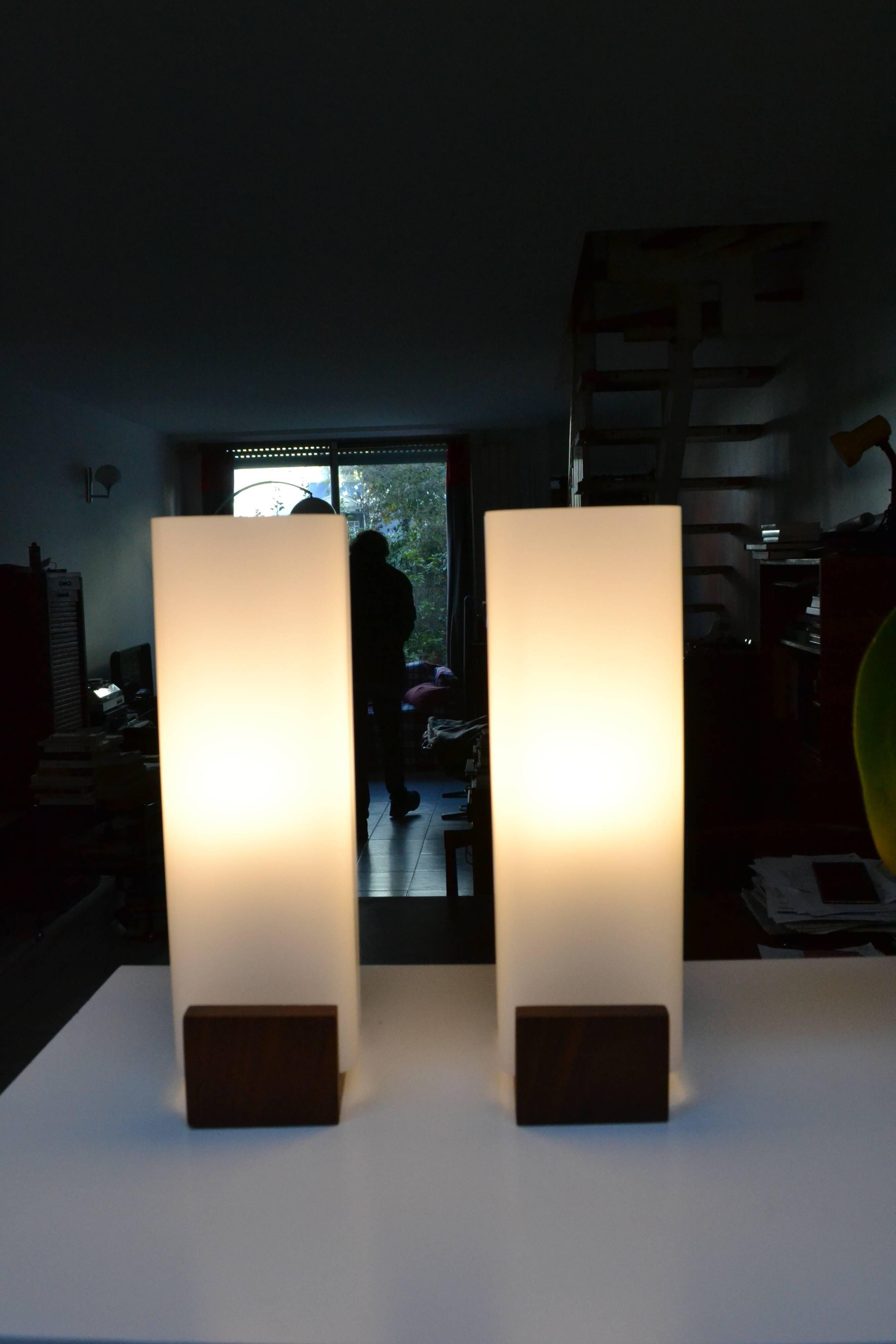 Pair of Louis Kalff opaline and teak wall lamps